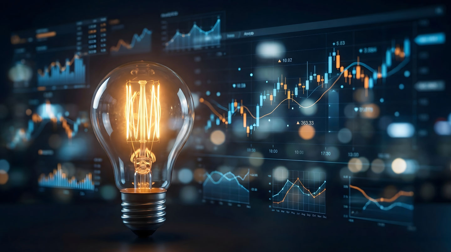 Écran de monitoring énergétique affichant des courbes de consommation horaire dans un local technique professionnel